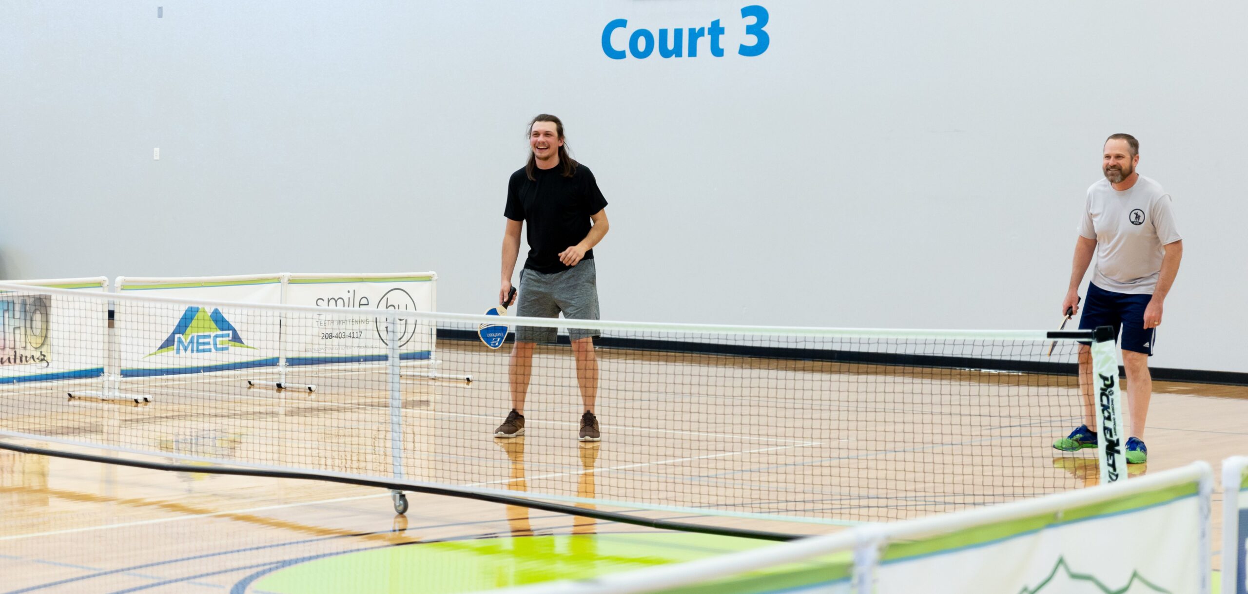 Garrett plays pickleball with office members