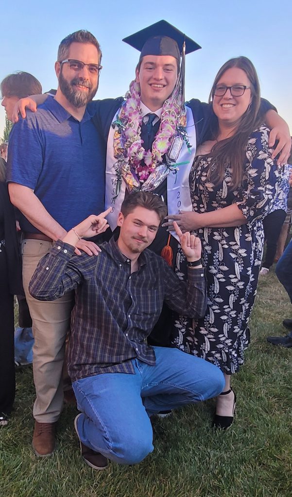 Graduation photo of matt and family.